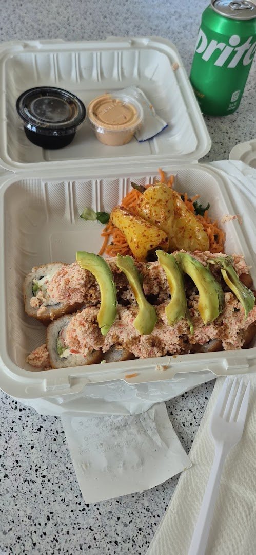 Plated rolls beside chopsticks in a relaxed dining room.